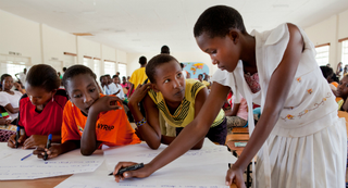 Young Masai girls participate in a group exercise at a 2013 alternative rites of passage workshop. (Anja Legtenberg)